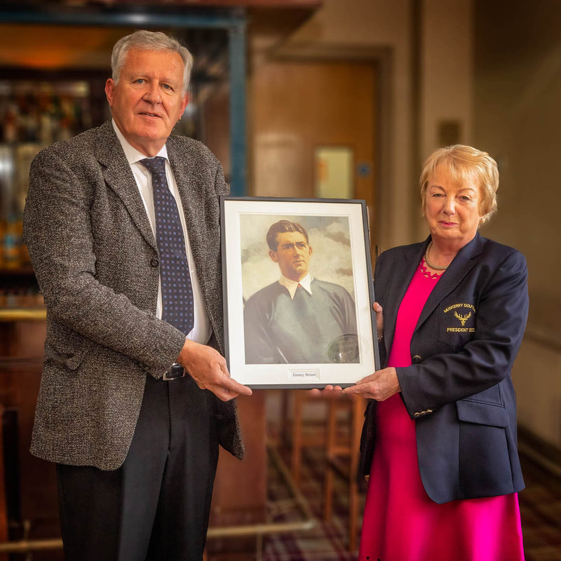 David Bruen, Son of Jimmy Bruen presenting the Portrait Photo of his father to Club President Marie Allen.